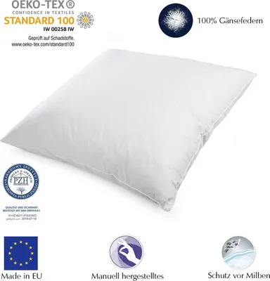 A white pillow is shown on a white background with various certification logos and text overlays.