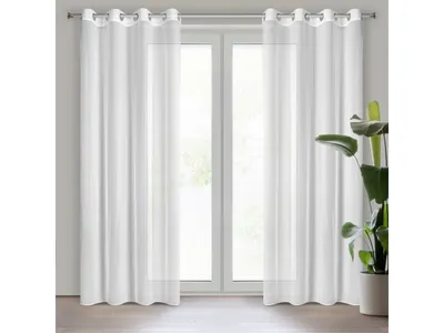 Two white sheer curtains hanging on a window.