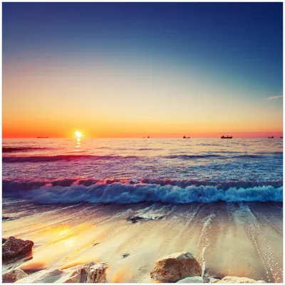 Produktbild von Wallario Memoboard Magnettafel aus Glas, Größe 50 x 50 cm, Motiv Sonnenuntergang am Meer mit Wellen am Strand