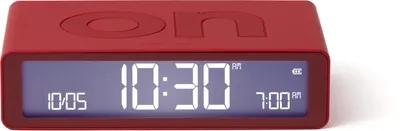 A red digital alarm clock is shown against a white background.