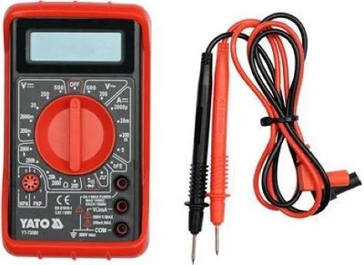 A digital multimeter and its probes are shown against a white background.