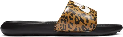 A side view of a single Nike Victori One Slide with a leopard print.