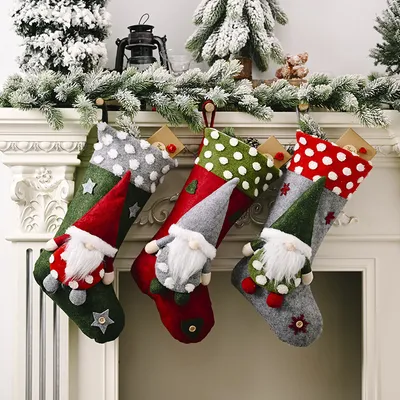 Christmas stockings hanging on a fireplace mantel.