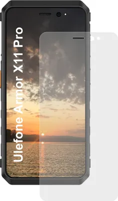 A screen protector is placed over a smartphone screen displaying a sunset.