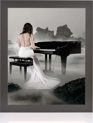 A woman in a white dress plays a grand piano in a foggy, rocky landscape.
