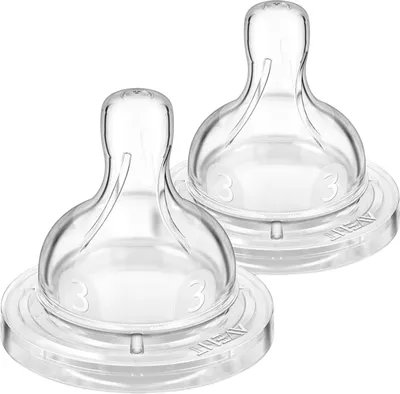 Two clear silicone baby bottle nipples are shown against a white background.