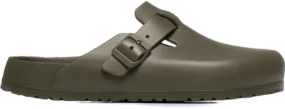 A single green clog is shown from the side against a white background.