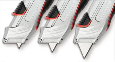Produktbild von Cutter Safety Profi Trapezklinge incl. 5 Ersatzklingen schwarz Packung mit 12 Stück