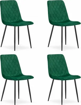 Four dark green velvet chairs with diamond quilting and black metal legs are arranged in a two-by-two grid against a white background.