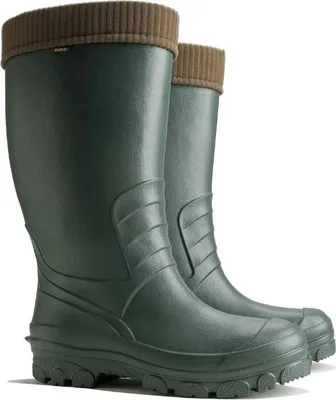 A pair of green rubber boots with brown knitted cuffs.