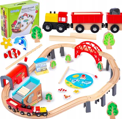A wooden train track set for children, including a train, wagons, bridge, and various accessories, laid out on a white background.