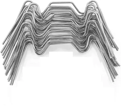 A stack of metal clips for greenhouse glass.