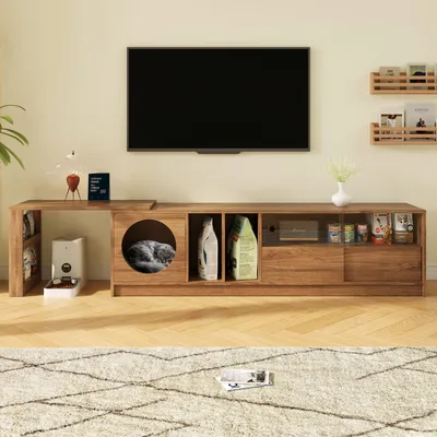 A living room scene featuring a TV stand with integrated cat furniture, a television, and decorative items.