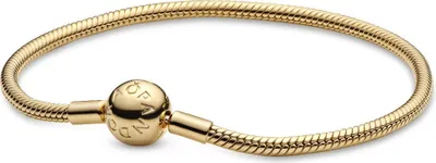 A close-up studio shot of a gold Pandora snake chain bracelet with a spherical clasp.