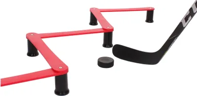 A hockey stick, puck, and training cones are arranged on a white background.