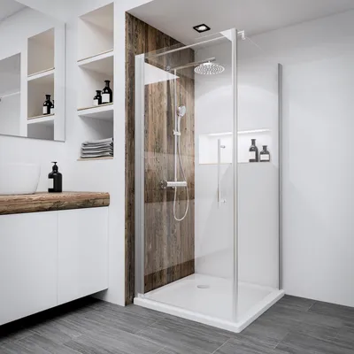 A modern bathroom with a glass shower enclosure.