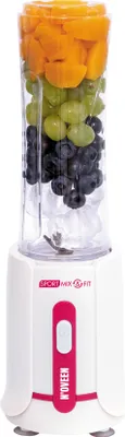 A blender filled with fruit and ice, placed on a white background.