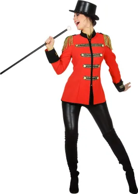 A woman in a circus director costume holding a cane.