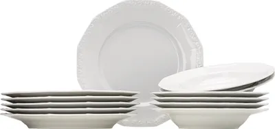 A set of white ceramic plates and bowls stacked against a white background.
