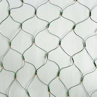 A close-up view of a green LED net light string against a white background.