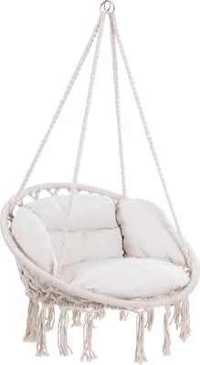 A beige macrame hanging chair with cushions, suspended by ropes.