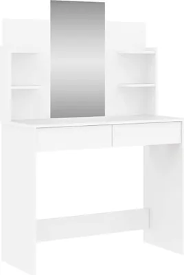 A white vanity table with a mirror and shelves.