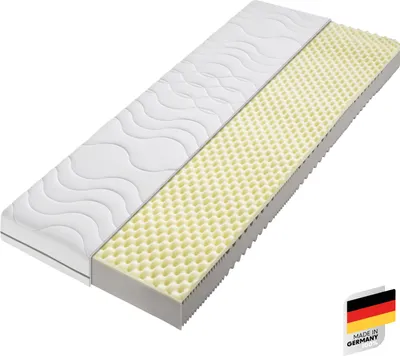 A mattress shown in a cross-section, revealing its layered construction.