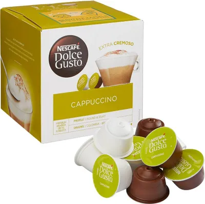 A box of Nescafé Dolce Gusto Cappuccino coffee pods with several pods scattered in front of it.