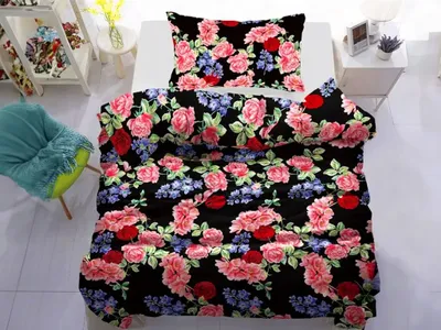 A bed with floral bedding.