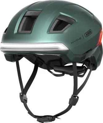 A green bicycle helmet with integrated lights.