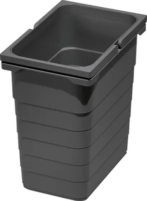 A dark gray plastic waste bin with horizontal ridges on its body and a rectangular opening at the top.