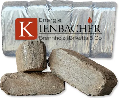 Several peat briquettes are shown in the foreground, with a packaged set of briquettes in the background.