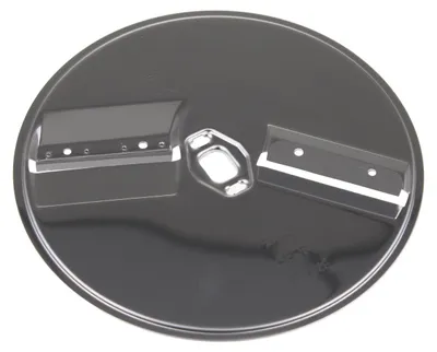 A close-up, top-down view of a food processor cutting disc.