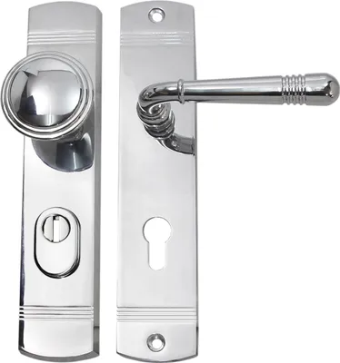 A pair of chrome door handles and a door knob with a keyhole plate.