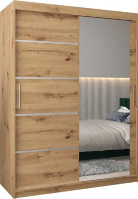 A bedroom scene reflected in the mirror of a wardrobe.