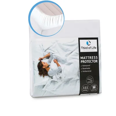 A mattress protector package with a lifestyle image of a person sleeping on a bed.