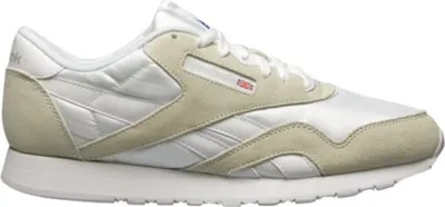 A side view of a white and beige Reebok Classic Nylon sneaker.