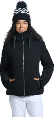 A woman wearing a black ski jacket and a patterned beanie.