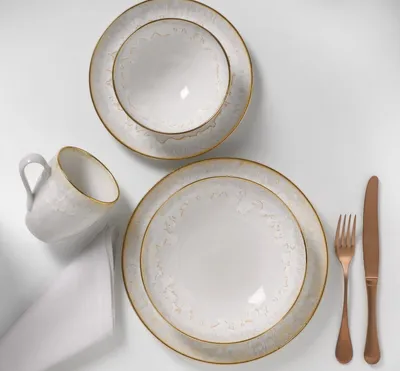 Produktbild von Costa Nova Geschirr Taormina Weiß mit goldenem Rand, 5-teiliges Set - Essteller - Suppenteller - Frühstücksteller - Schüssel - Becher