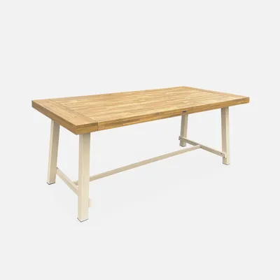 A wooden and metal dining table on a white background.
