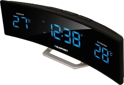 A digital alarm clock with a curved display showing indoor and outdoor temperatures, time, and brand name.