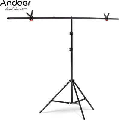 Produktbild von Andoer 2 * 2m / 6,5 * 6,5ft T-foermiger Hintergrundstaender Hintergrundhalterung Kit Aluminiumlegierung Material Hochleistungs tragbar Einstellbare Hoehe fuer Fotografie Videostudio mit Federclip Schwarz