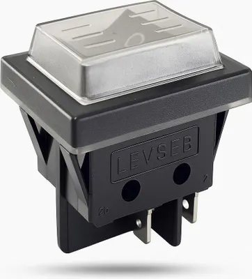 A product shot of a black and clear switch with metal terminals.