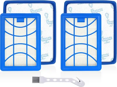 A studio shot of two vacuum cleaner filters and a cleaning brush.