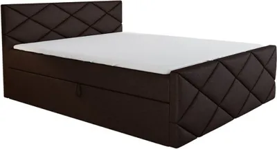 A brown upholstered bed with a white mattress.