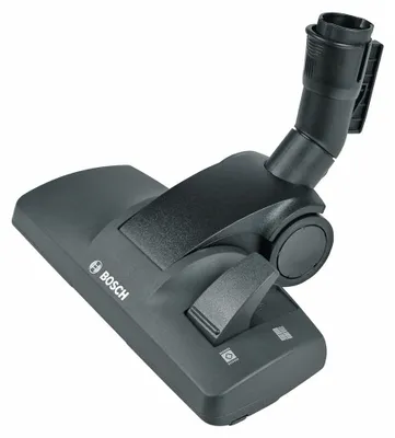 A close-up shot of a black vacuum cleaner floor head.