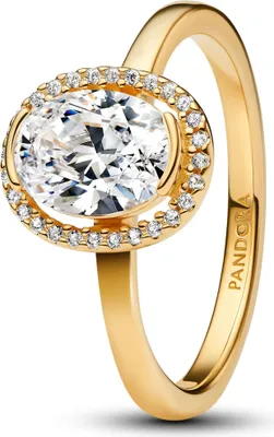 A close-up studio shot of a gold Pandora ring with a large oval clear stone surrounded by smaller clear stones.
