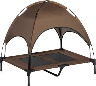 A brown elevated dog bed with a canopy.