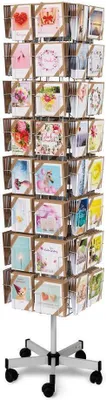 A rotating display stand filled with greeting cards.