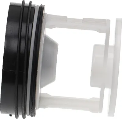 A close-up side view of a washing machine lint filter.